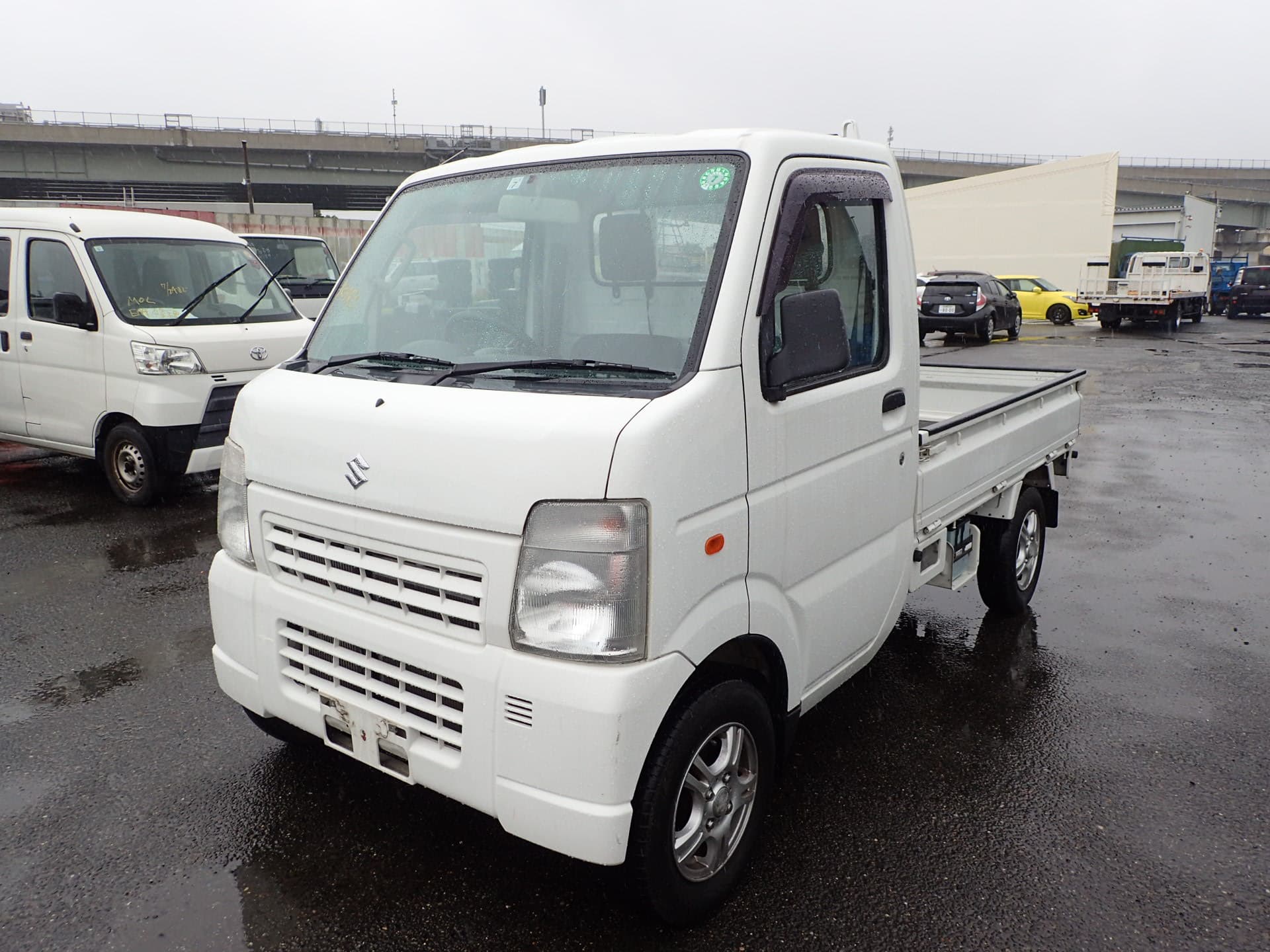 2010 Suzuki Carry Truck Flatbed 4WD 5-Speed Manual Super Low Kms — photo 1 of 24